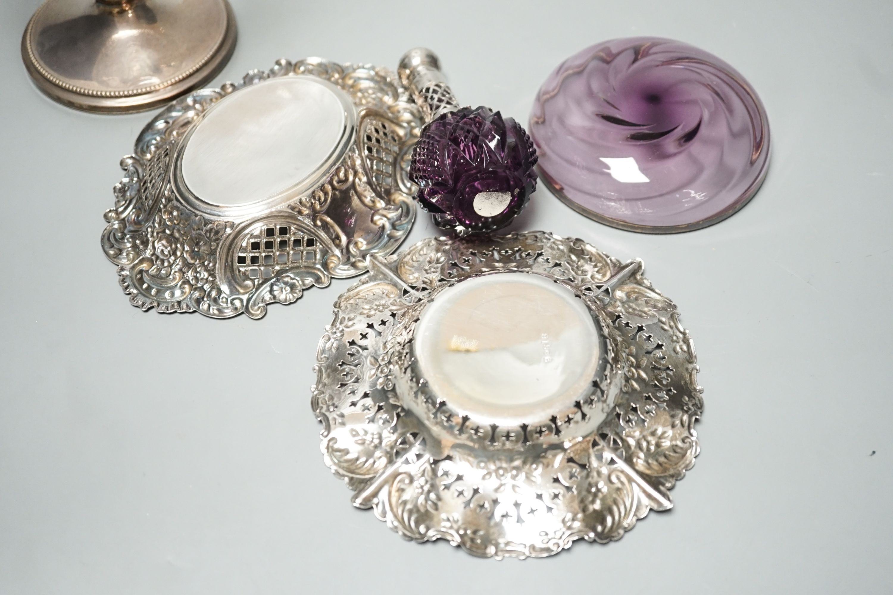 Two pierced silver trinket dishes, a late Victorian silver mounted amethyst glass dish, a similar scent flask and a silver mounted glass bowl.